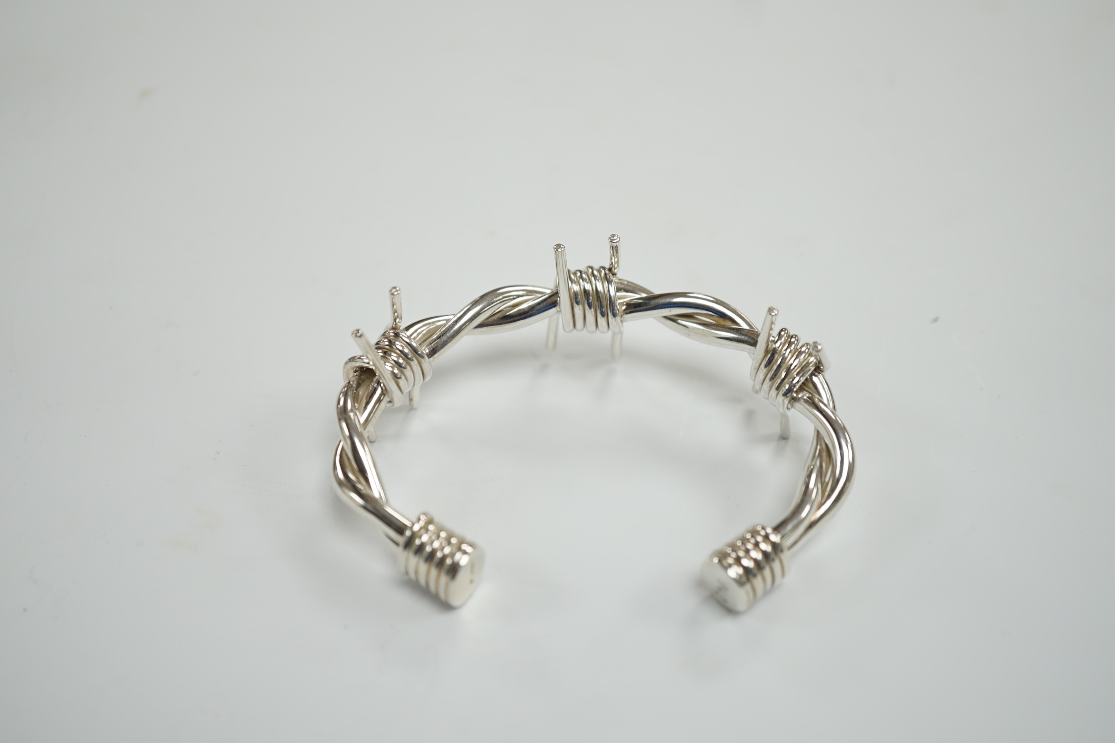 A modern silver 'barbed wire' open bangle, by M. Marlow, Edinburgh, 2006, overall width 83mm, 74 grams.